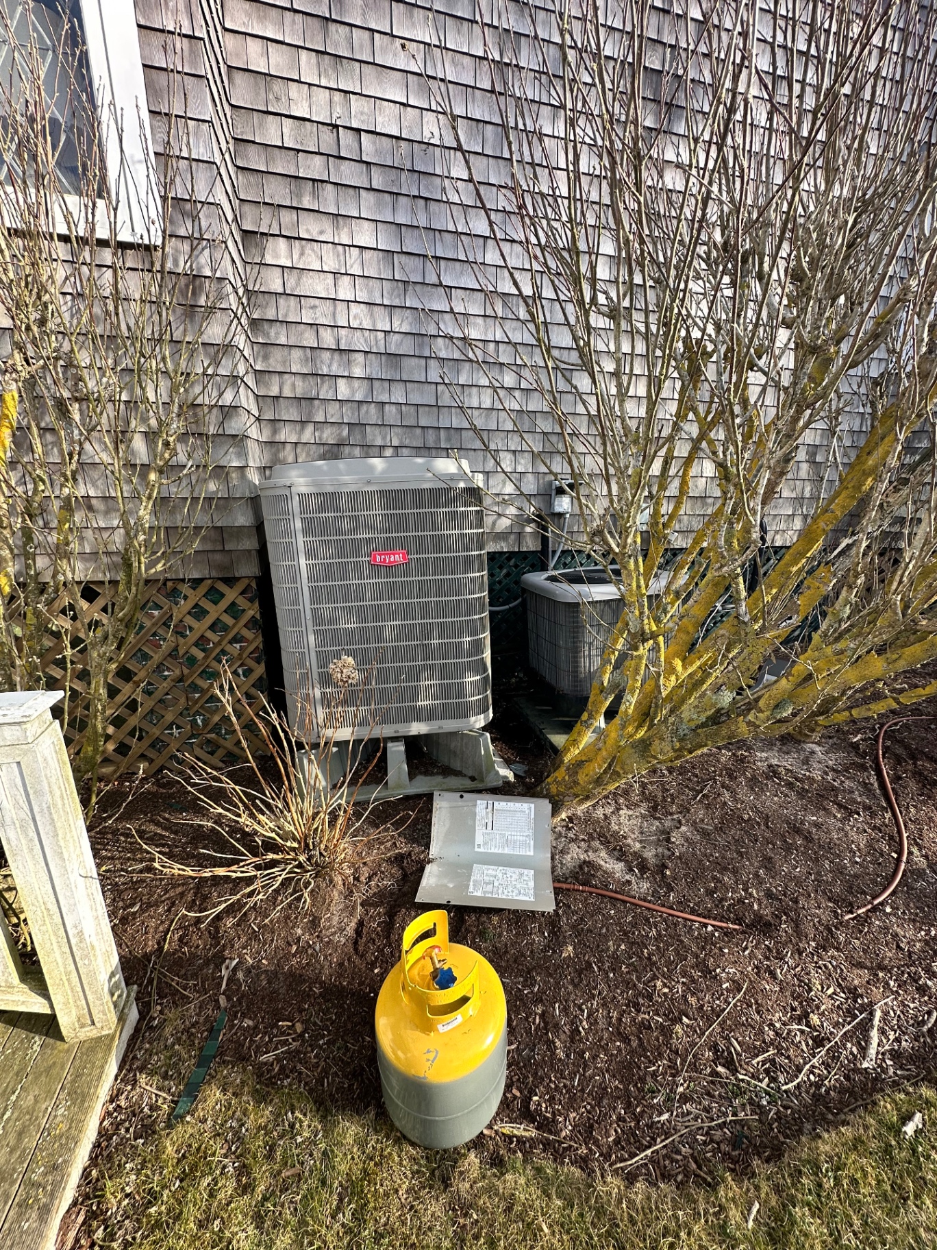 Old Bryant condenser being removed from a Nantucket property