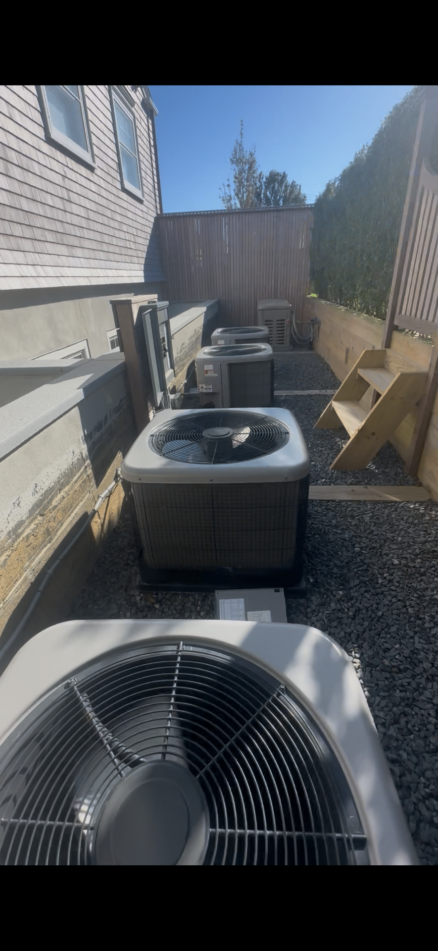 AIRTECH technician servicing a heat pump