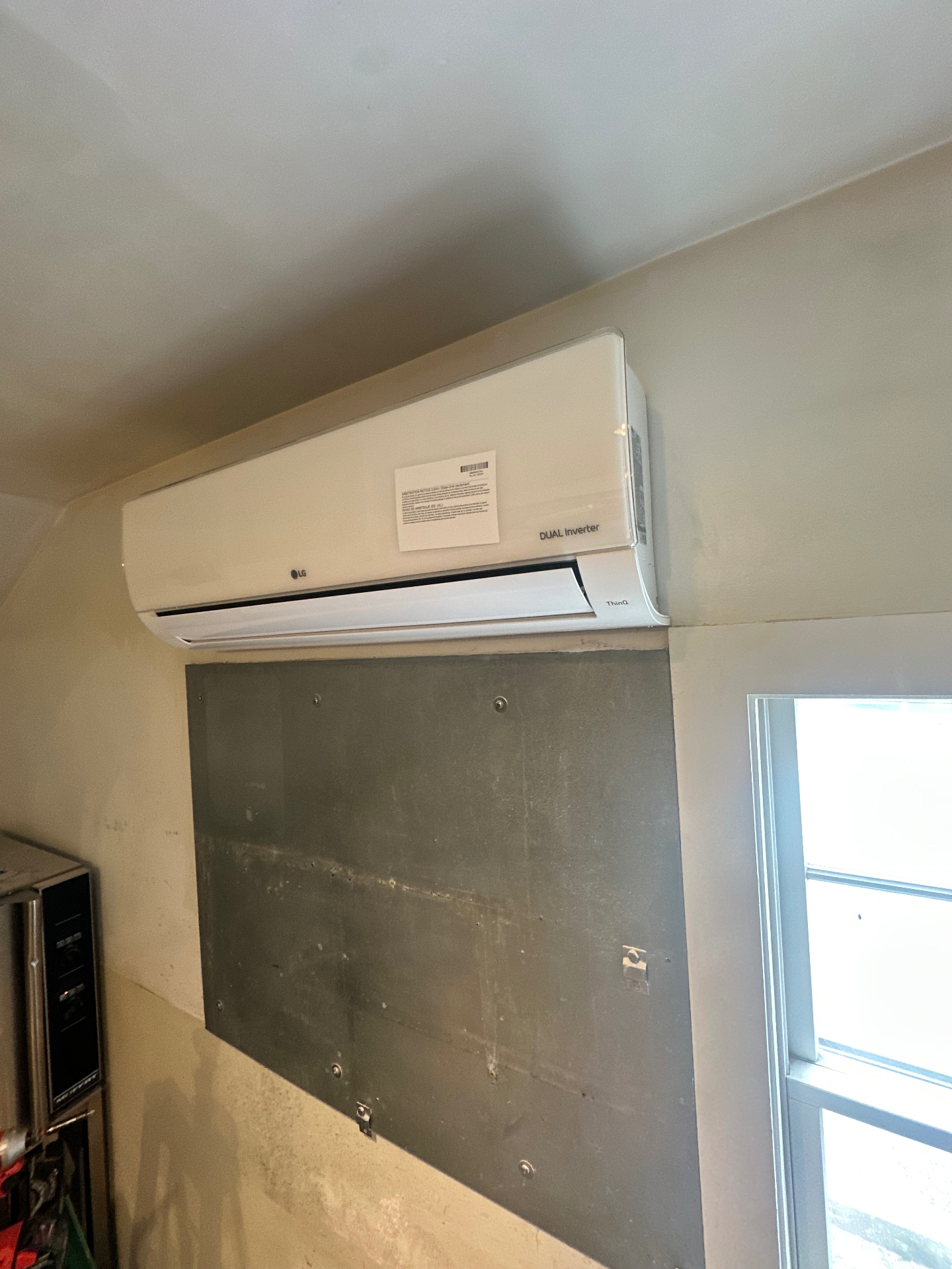 LG ductless mini-split indoor head mounted high on an interior wall